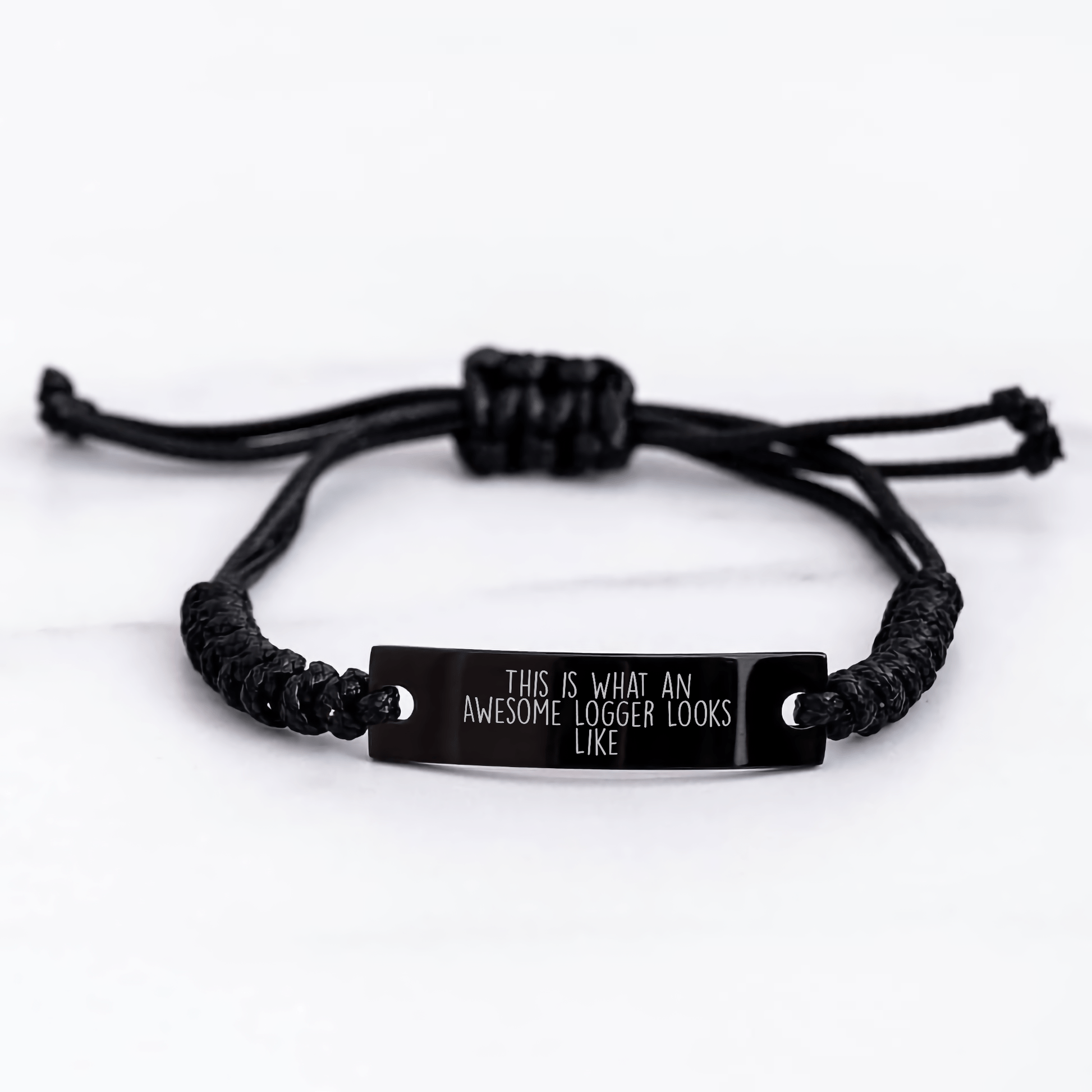Father's Day Unique Gift Ideas for Logger Men - Inspirational Rope Bracelet with Quote 'This Is What An Awesome Logger Looks Like' - Adjustable Black Rope Gift from Dad to Logger Friends - The Buy Boom