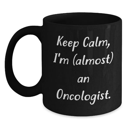 Funny Oncologist Gifts for Graduation - Keep Calm, I'm (almost) An Oncologist. Black Coffee Mug for Men, Women, Friends, Coworkers, Family - The Buy Boom