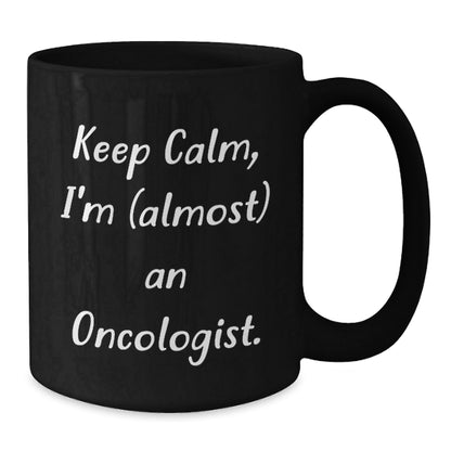 Funny Oncologist Gifts for Graduation - Keep Calm, I'm (almost) An Oncologist. Black Coffee Mug for Men, Women, Friends, Coworkers, Family - The Buy Boom