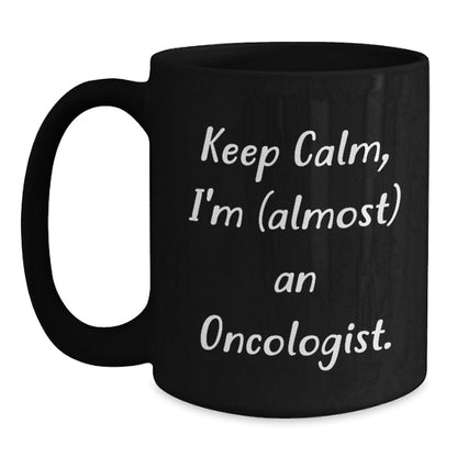 Funny Oncologist Gifts for Graduation - Keep Calm, I'm (almost) An Oncologist. Black Coffee Mug for Men, Women, Friends, Coworkers, Family - The Buy Boom