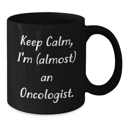 Funny Oncologist Gifts for Graduation - Keep Calm, I'm (almost) An Oncologist. Black Coffee Mug for Men, Women, Friends, Coworkers, Family - The Buy Boom