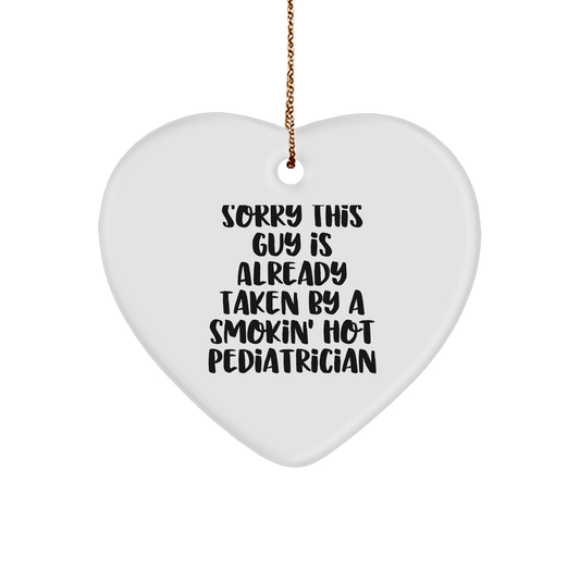 Funny Pediatrician Gifts from Friends for Christmas - Heart Ornament with Quote 'Sorry This Guy Is Already Taken By A Smokin' Hot Pediatrician' - The Buy Boom