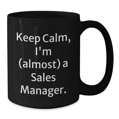 Funny Sales Manager Gift, 'Keep Calm, I'm (almost) A Sales Manager.' Black Coffee Mug for Birthday, Gifts from Friends to Coworkers - The Buy Boom