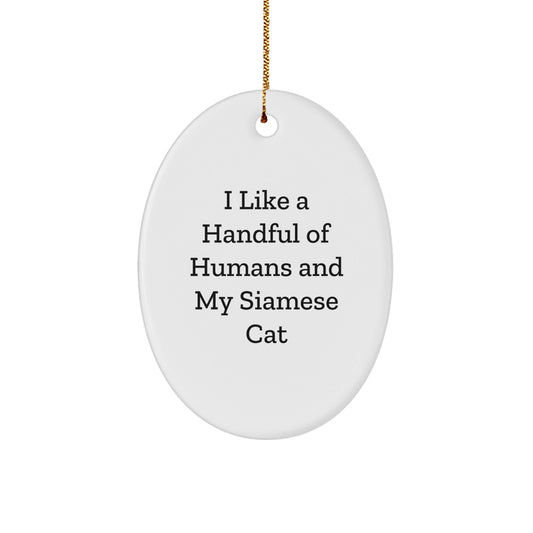 Funny Siamese Cat Gifts for Friends, Siamese Cat Lovers, and Christmas Decor - 'I Like A Handful Of Humans And My Siamese Cat' Oval Ornament - The Buy Boom