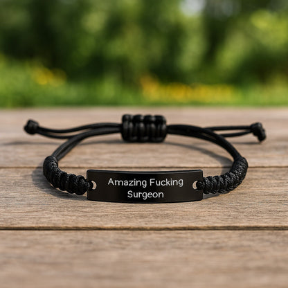 Funny Surgeon Gifts for Him - Black Rope Bracelet with Quote 'Amazing F - king Surgeon' - Christmas Unique Presents from Friends to Men - The Buy Boom